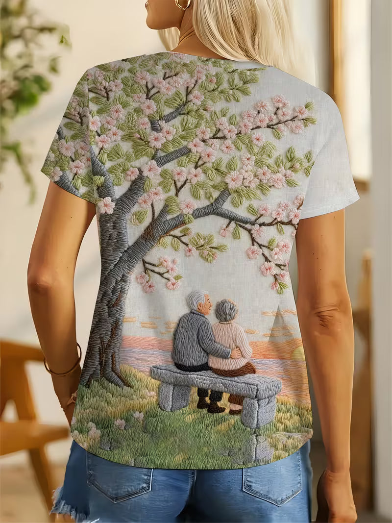 Cherry Blossom Tree and Couple on Beach Bench | Crew Neck, Short Sleeve T-Shirt
